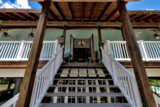 Stairs leadign to front door