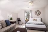 Cozy attic bedroom and sitting area